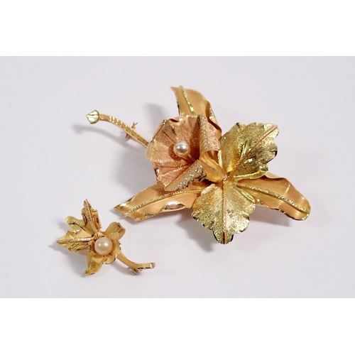 479 - An 18 carat two tone gold orchid brooch, 7.5 x 5cm set pearl and smaller brooch to match, 16g