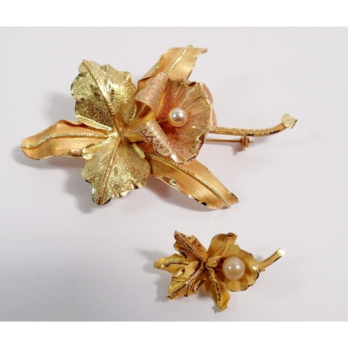 479 - An 18 carat two tone gold orchid brooch, 7.5 x 5cm set pearl and smaller brooch to match, 16g