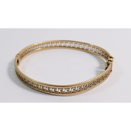 483 - A 9 carat gold Greek key hinged bangle, 12g