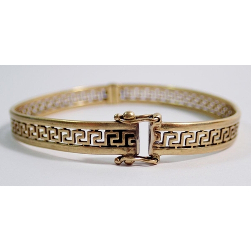 483 - A 9 carat gold Greek key hinged bangle, 12g