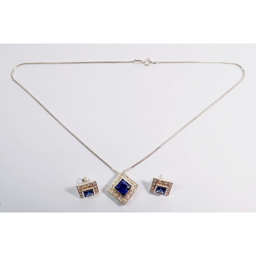 489 - A silver square pendant necklace and earrrings set blue and white stones