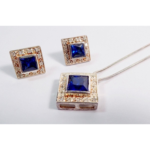 489 - A silver square pendant necklace and earrrings set blue and white stones