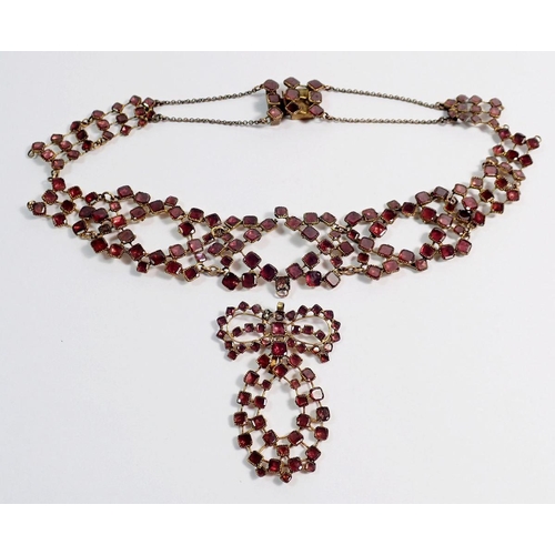 491 - An antique garnet set gilt metal necklace - some repair needed