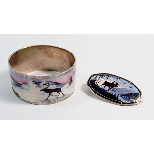 492 - A Norwegian silver brooch decorated reindeer by Aksel Holmsen, 3.2 x 1.3cm and a napkin ring - both ... 