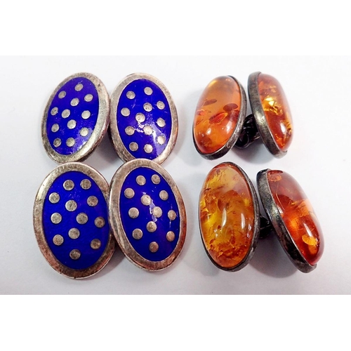 521 - A pair of silver and amber cufflinks and a pair of silver and blue enamel cufflinks with box