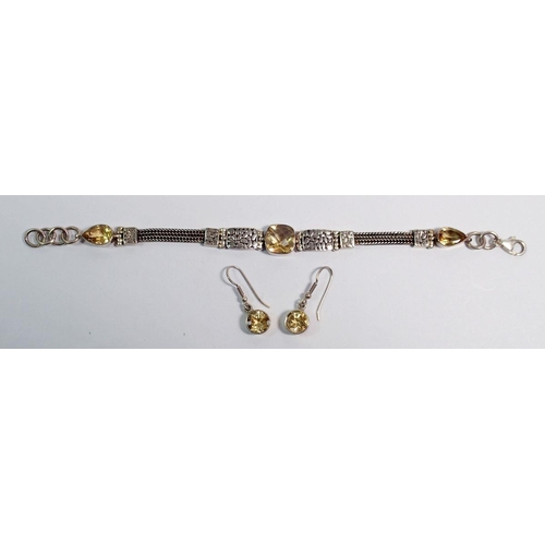 524 - A silver and citrine bracelet and a pair of silver and citrine earrings