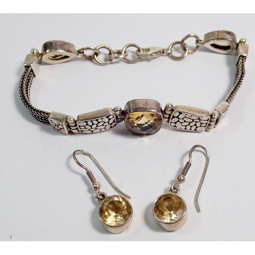 524 - A silver and citrine bracelet and a pair of silver and citrine earrings