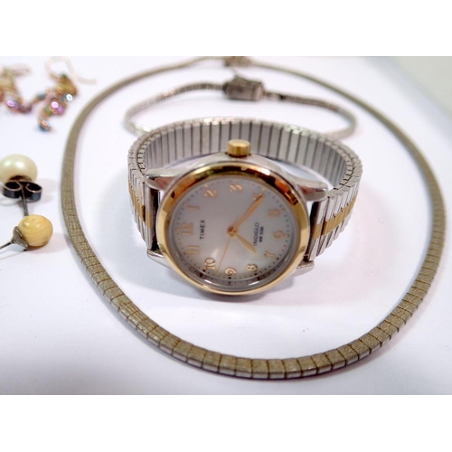 535 - A Timex ladies watch with mother of pearl face, silver bracelet and necklace and yellow metal earrin... 