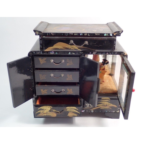 554 - A Japanese musical lacquer jewellery cabinet/box, movement a/f, 23 x 24cm