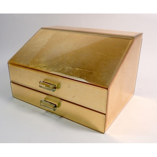 555 - A gold coloured mirrored jewellery box and contents of costume jewellery