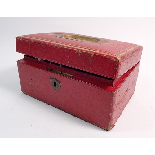 556 - A Victorian red leather jewellery box and contents of beads