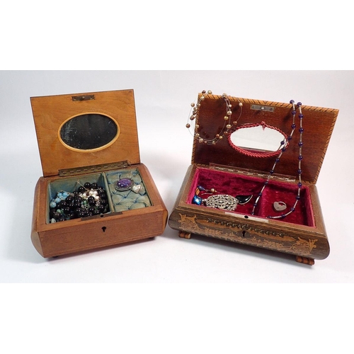 561 - Two musical jewellery boxes including a selection of costume jewellery, silver heart padlock, brooch... 