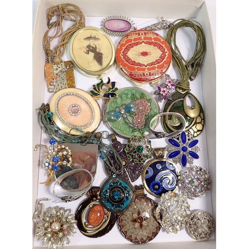 569 - A box of compacts, costume jewellery and two dragonfly napkin rings