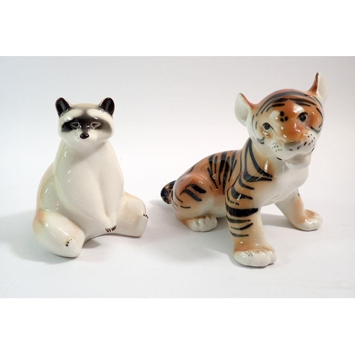 58 - A Russian Lomonosov tiger, 13cm tall and a racoon