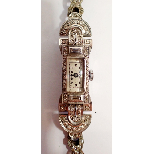 590 - A platinum Art Deco ladies wrist watch set diamonds (unmarked but tested), all on silver and paste s... 