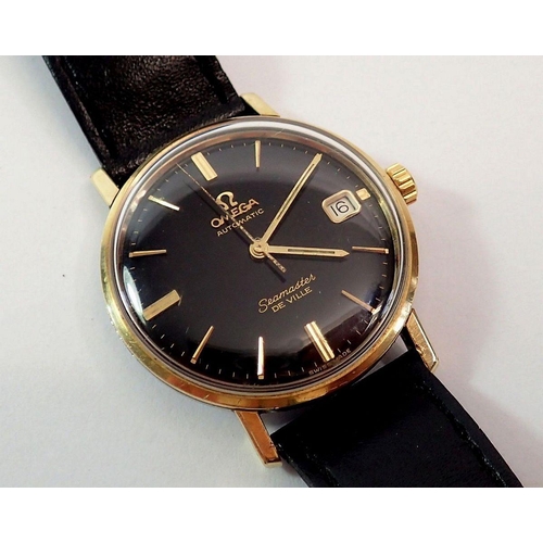 594 - An Omega Automatic Seamaster De Ville gentleman's gold plated wrist watch, black dial with baton hou... 