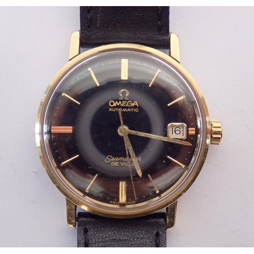 594 - An Omega Automatic Seamaster De Ville gentleman's gold plated wrist watch, black dial with baton hou... 