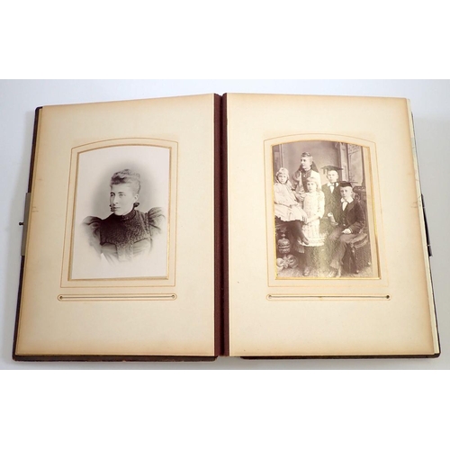 651 - A Victorian photograph album and contents of carte de visite portraits