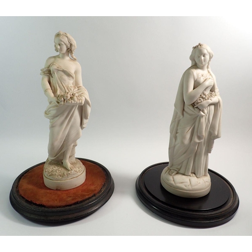 7 - Two Victorian Parian figures of classical women under glass domes, 41cm tall