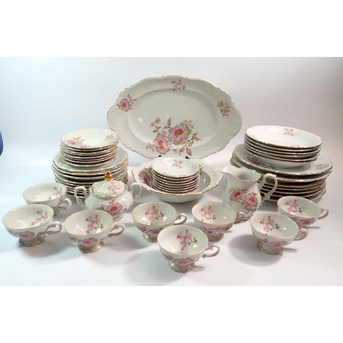 79 - A Bavarian Mitterteich part dinner service painted pink flowers comprising eight cups and saucers, m... 