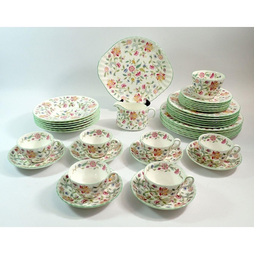 82 - A Minton's Haddon Hall dinner service comprising six dinner plates, six breakfast plates, six bowls,... 