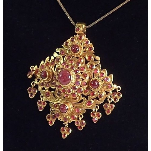 443 - An Indian high grade gold square openwork pendant set multiple cabochon rubies with cabochon ruby dr... 