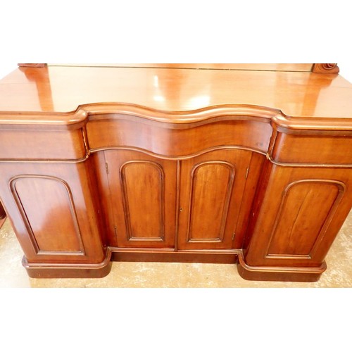 1375 - A Victorian mahogany serpentine fronted mirror back sideboard with scroll carved surmount, 150cm wid... 