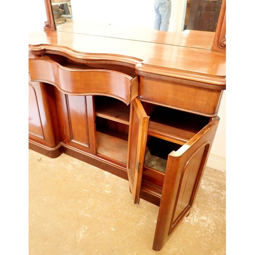 1375 - A Victorian mahogany serpentine fronted mirror back sideboard with scroll carved surmount, 150cm wid... 