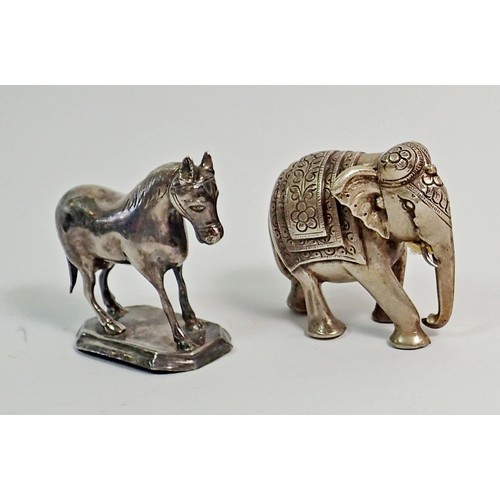 308 - An Indian white metal miniature elephant 6cm tall and a white metal model horse