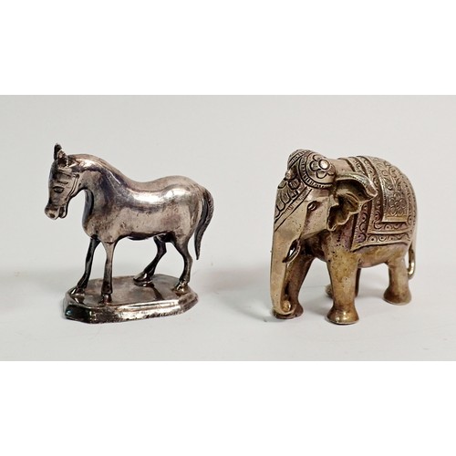 308 - An Indian white metal miniature elephant 6cm tall and a white metal model horse