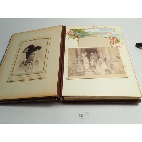 651 - A Victorian photograph album and contents of carte de visite portraits