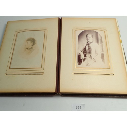 651 - A Victorian photograph album and contents of carte de visite portraits