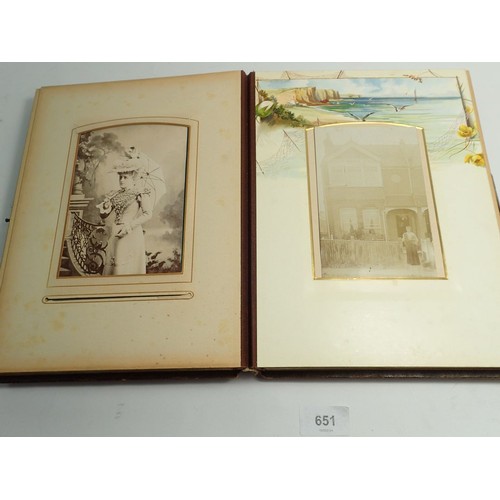 651 - A Victorian photograph album and contents of carte de visite portraits