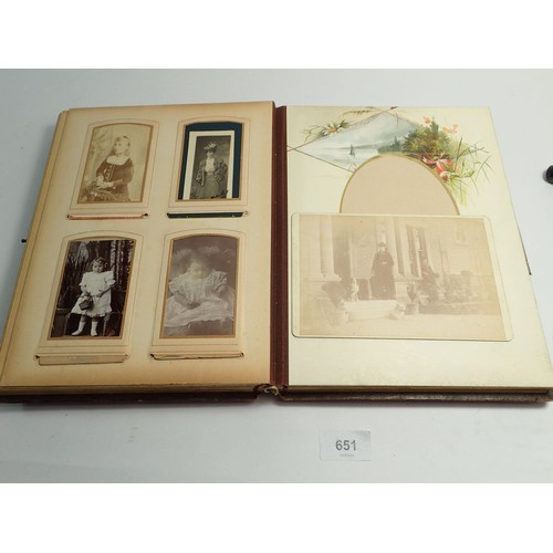 651 - A Victorian photograph album and contents of carte de visite portraits