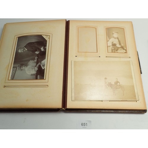 651 - A Victorian photograph album and contents of carte de visite portraits