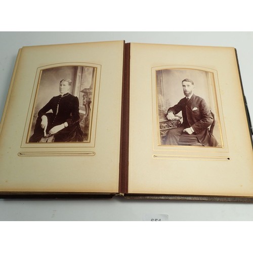 651 - A Victorian photograph album and contents of carte de visite portraits