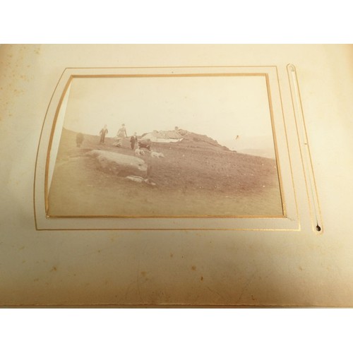 651 - A Victorian photograph album and contents of carte de visite portraits