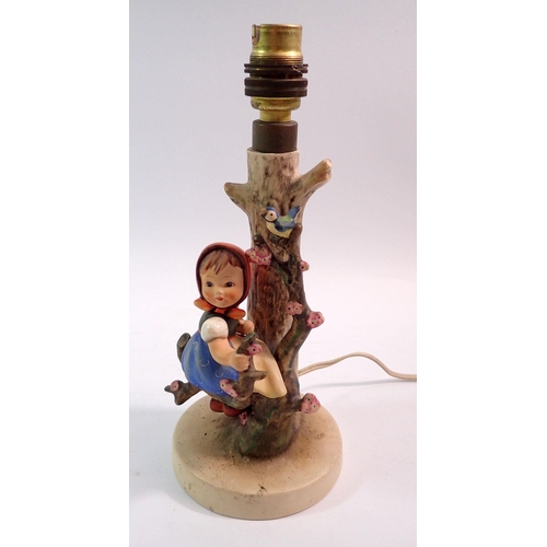 105 - A Hummel table lamp with girl seated in tree, 24cm high