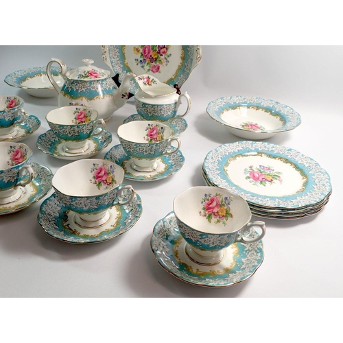 108 - A Royal Albert Enchantment tea service comprising teapot, eight cups and saucers, eight tea plates, ... 