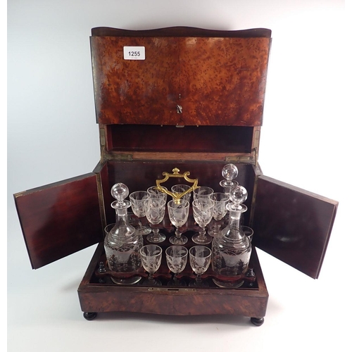 1255 - A 19th century French amboyna travelling decanter box with fitted interior including four cut glass ... 