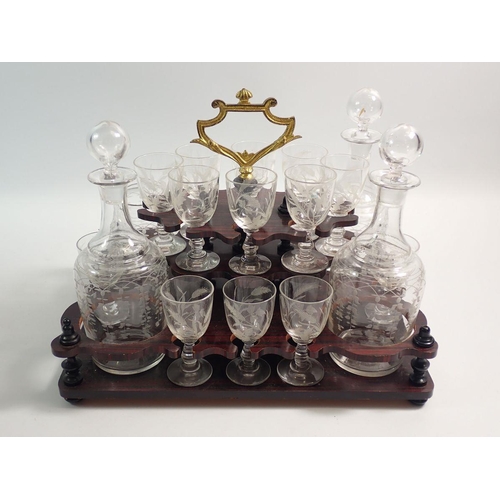 1255 - A 19th century French amboyna travelling decanter box with fitted interior including four cut glass ... 