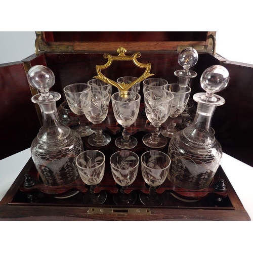 1255 - A 19th century French amboyna travelling decanter box with fitted interior including four cut glass ... 