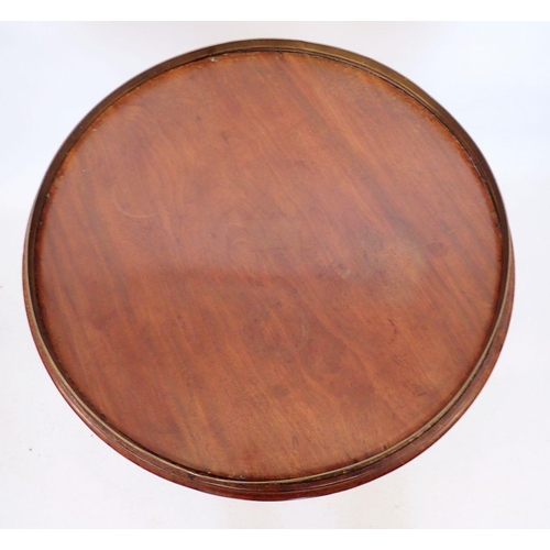 1256 - A 19th century mahogany circular occasional table with brass bound rotating top, all on reeded colum... 