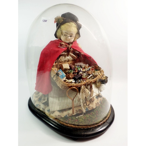 1260 - A large Victorian wax headed peddler doll with tray of wares, under glass dome, approx 48cm