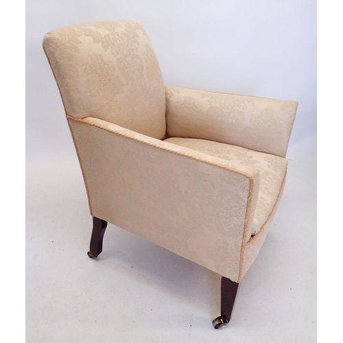 1266 - An Edwardian upholstered tub chair on tapered supports