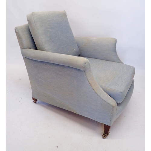 1268 - A Howard and Sons Clayton pale blue upholstered tub armchair on castors, stamped mark to back leg