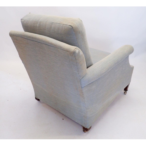 1268 - A Howard and Sons Clayton pale blue upholstered tub armchair on castors, stamped mark to back leg