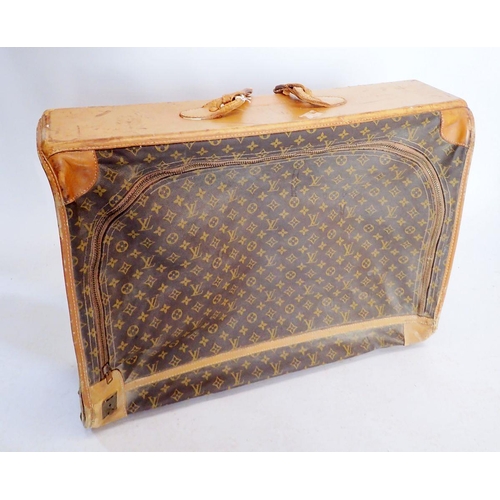 1270 - A Louis Vuitton early 20th century suitcase made in the USA, soft sides, label to interior - handle ... 