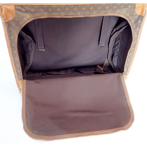 1270 - A Louis Vuitton early 20th century suitcase made in the USA, soft sides, label to interior - handle ... 