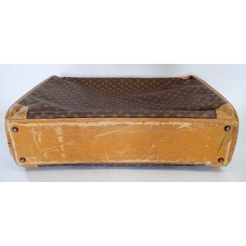 1270 - A Louis Vuitton early 20th century suitcase made in the USA, soft sides, label to interior - handle ... 